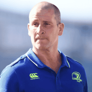 Leinster Rugby Coach and former Head Coach of the England Rugby team Stuart Lancaster wearing a blue coaching top on the pitch
